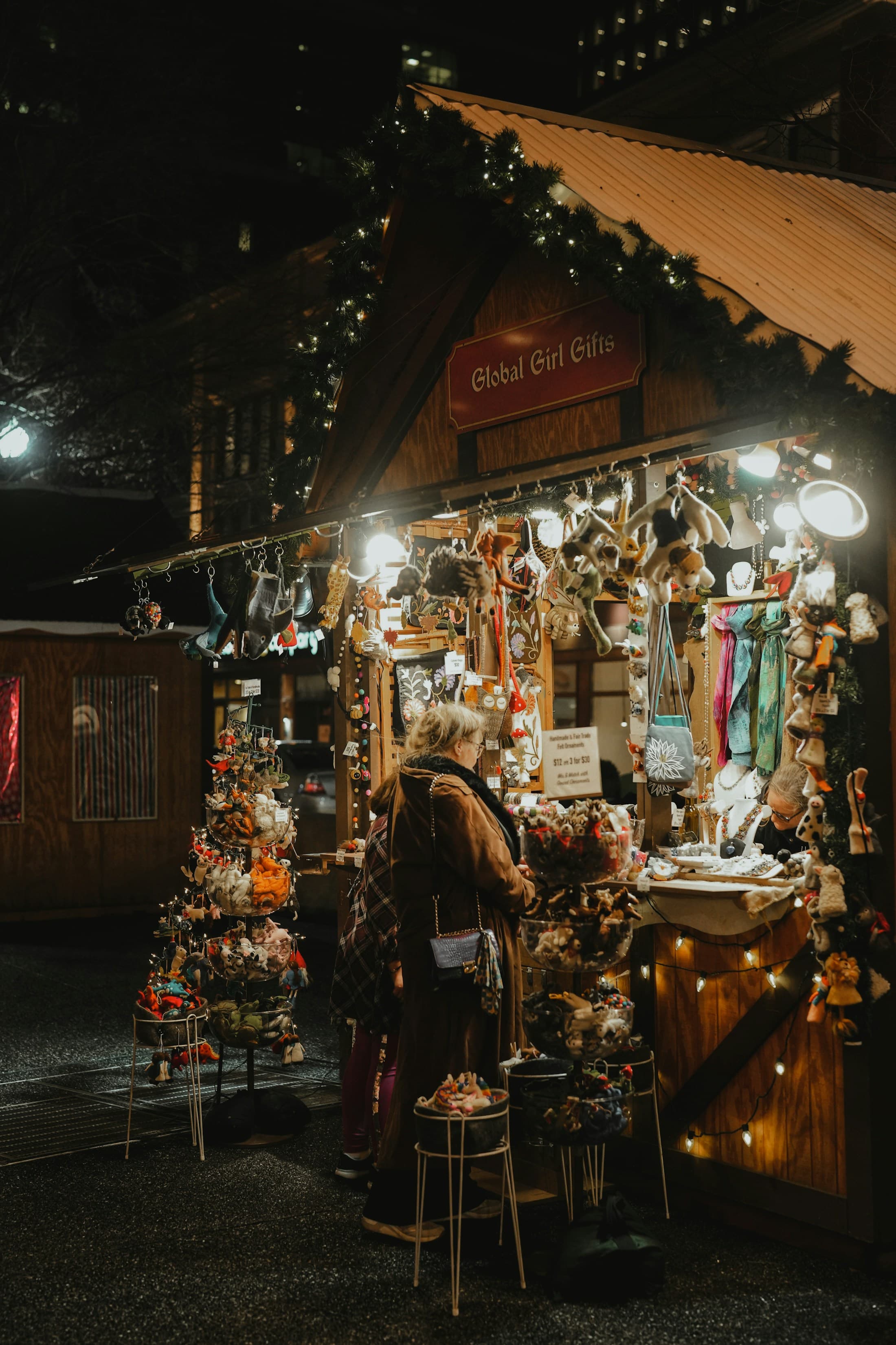 A Christmas market stall filled with handmade gifts and ornaments